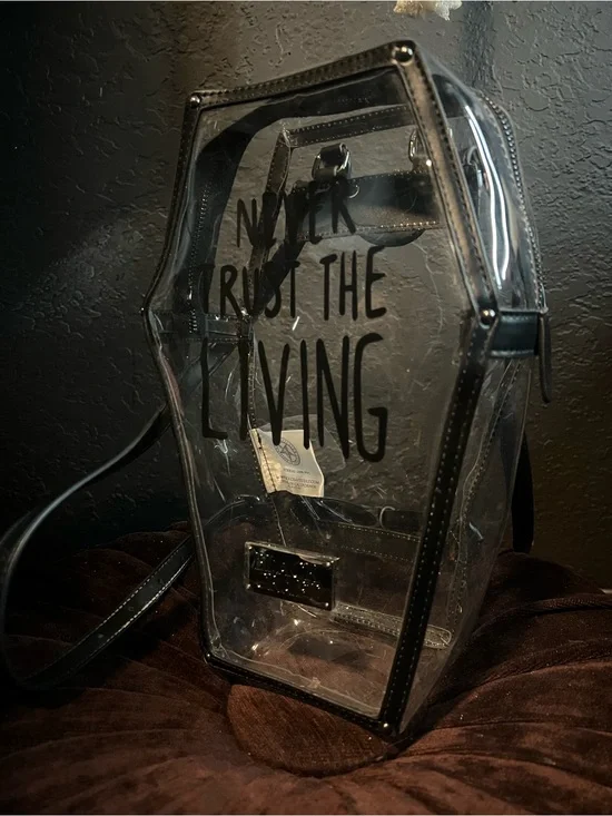 Never Trust the Living clear coffin backpack
