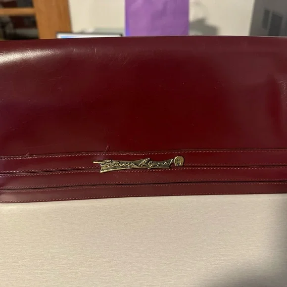Burgundy Leather Wristlet Clutch with Gold Script Emblem