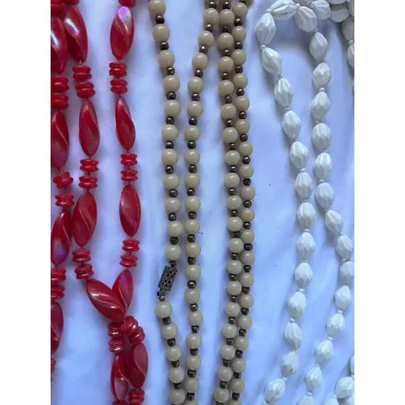 Lot of 4 plastic 1970's Vintage Long Necklaces