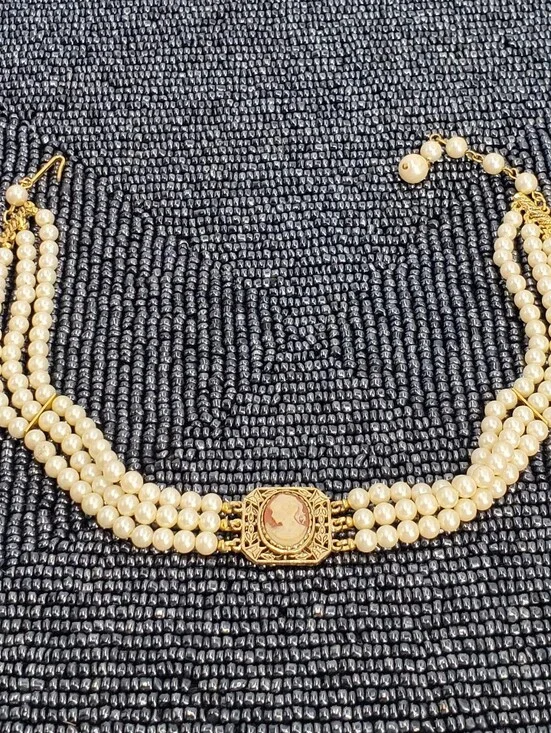 Vintage-style 3-strand pearl choker necklace with a prominent cameo centerpiece