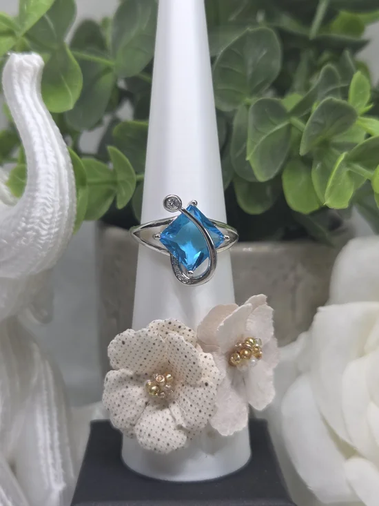 Blue Topaz Teardrop Ring With Silver Swirl Accent