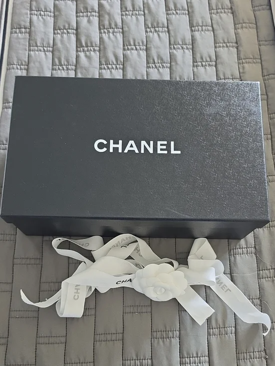 CHANEL Black Box with White Ribbon and Camellia Accent
