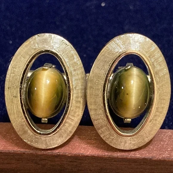 Cat’s eye and brushed silver tone cufflinks