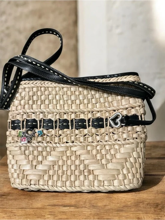 Brighton woven straw and leather trim crossbody bucket bag.