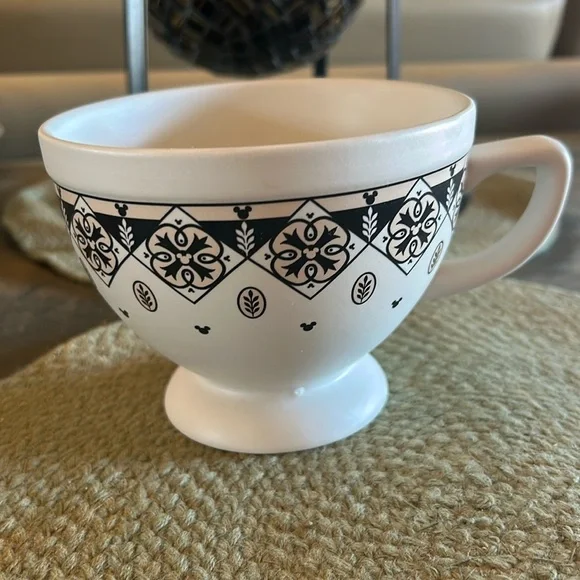 Disney cup or small soup bowl. White with black designs.