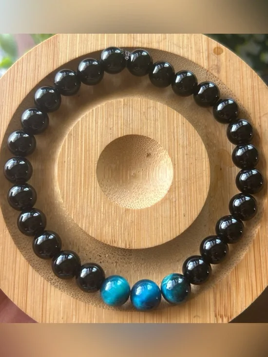 Men’s black tourmaline bracelet with three blue tiger eye accent beads