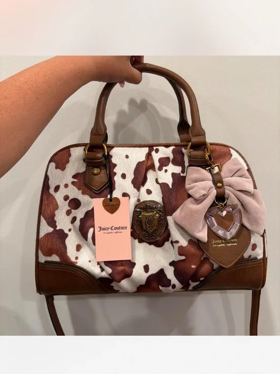 🎀Juicy Couture~Brown & White Cowprint Satchel with Pink Bow Charm