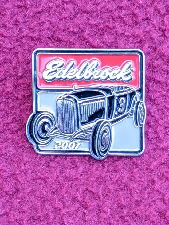 The product is a new 2007 Edelbrock hot rod hat or vest pin.
