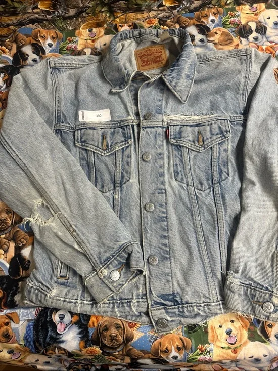 Levi's Light Wash Denim Trucker Jacket - Pale Blue. Heavily distressed.