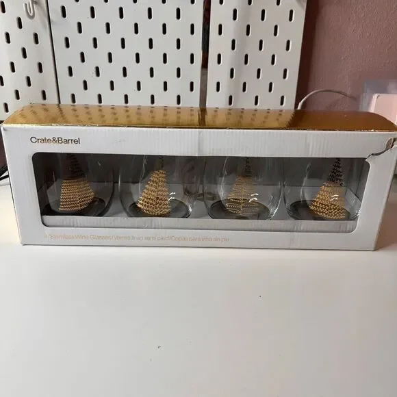 Crate & Barrel boxed set of 4 stemless wine glasses featuring a holiday tree des