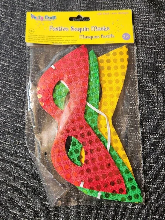 Festive sequin masks in red, green, and yellow with polka dots