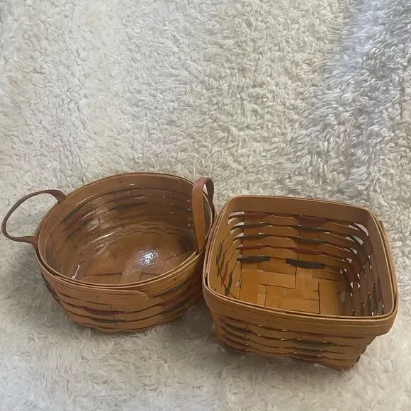 Longaberger 1995 set of two Handcrafted round and Square Woven baskets .