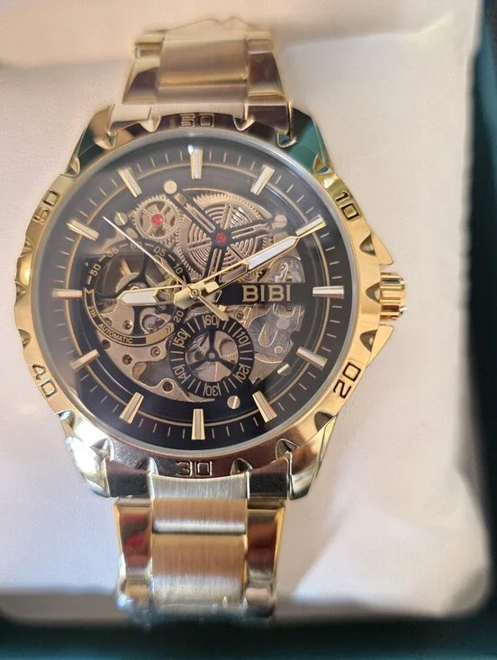 BiBi Gold Tone Skeleton Dial Watch with Black Accents