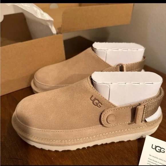 Brand new in box! UGG Kids Tan Slip-On Shoes