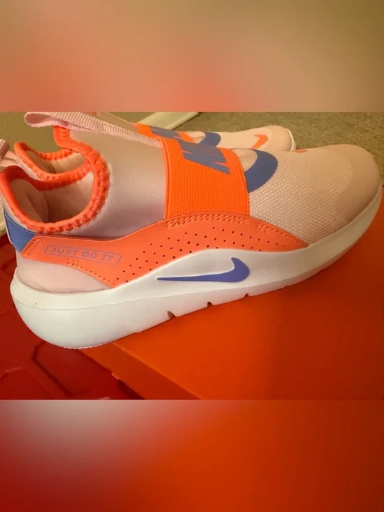Nike Kids Slip-On Sneakers in white Orange & Purple Accents