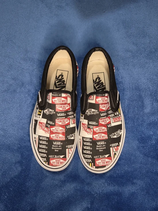 Vans Slip-On Skate Shoes in Black & White with Red Logo Print