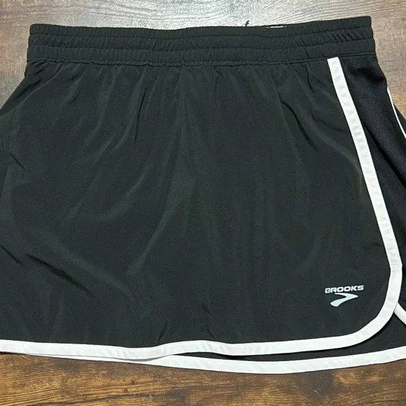 Brooks black running shorts with white side stripes 314.5