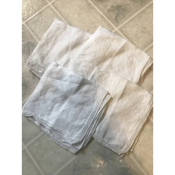 Set of Four White Linen Like Punched Pattern Napkins Delicate Edging