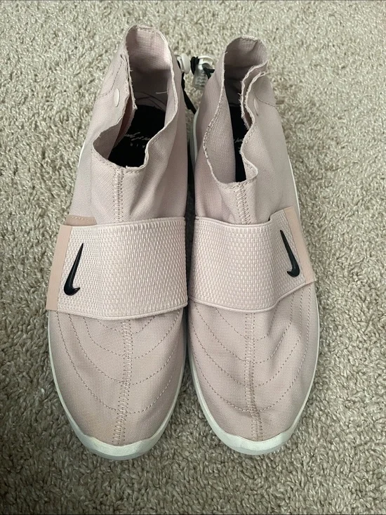 Nike Light Pink Slip-On Sneakers with Black Swoosh