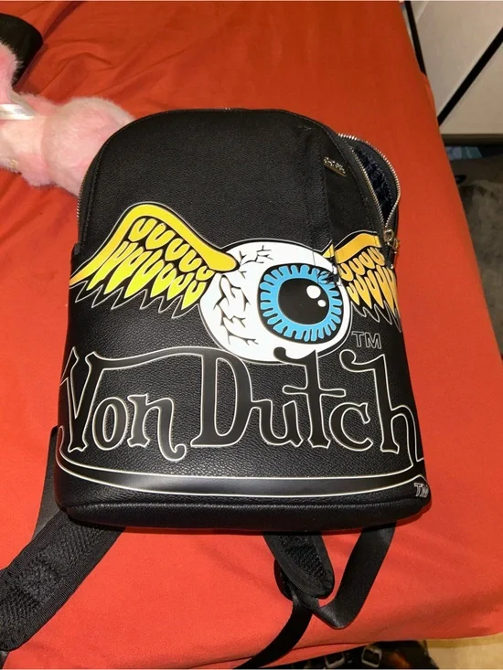 Von Dutch Black Crossbody Bag with Yellow Wings and Blue Eyeball Graphic