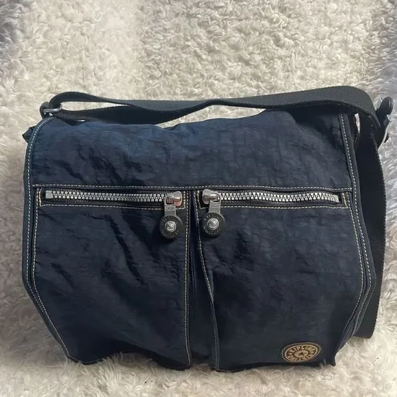 Kipling Nylon Expandable Navy Blue Large Messenger Bag  Key Clip. Black strap .