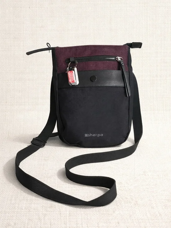 Sherpani Prima AT mini crossbody bag featuring a two-tone design with Merlot