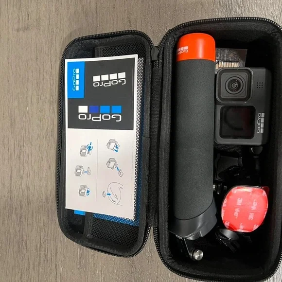 GoPro Black Camera with Orange Grip in Case