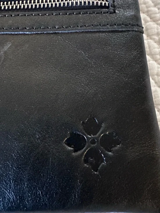 Patricia Nash Black Leather clutches with Embossed Clover Motif