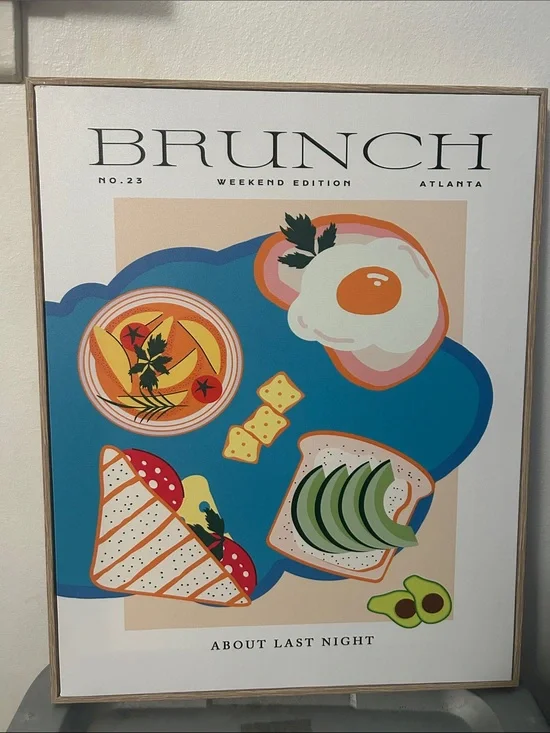 Ashland canvas wall art Brunch Weekend Edition Framed on a light wood-toned