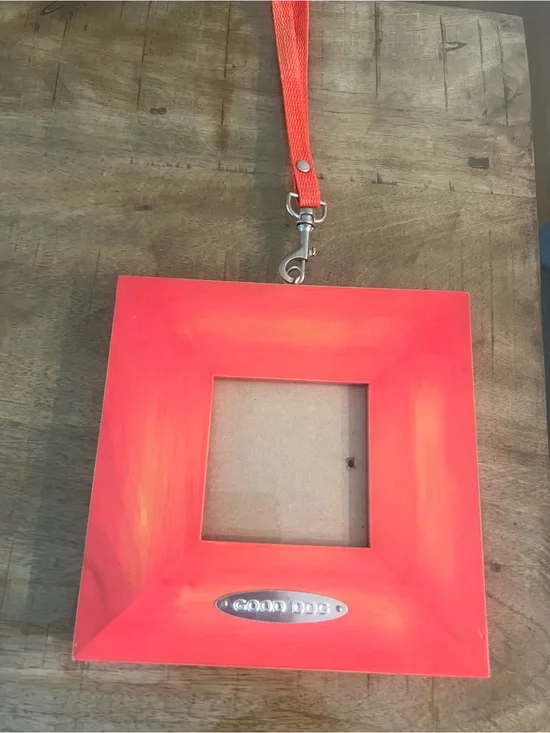 red/orange square photo frame features a 