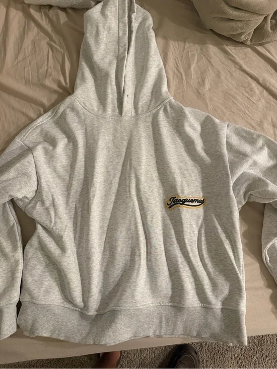 Jacquemus Light Gray Hoodie with Black and Yellow Logo