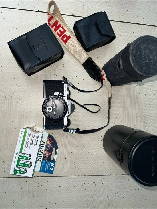 Pentax 35mm Camera with Cream and Red Branded Strap Untested