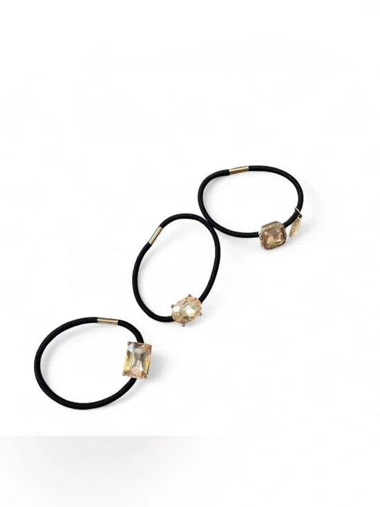 black hair ties with gold accents