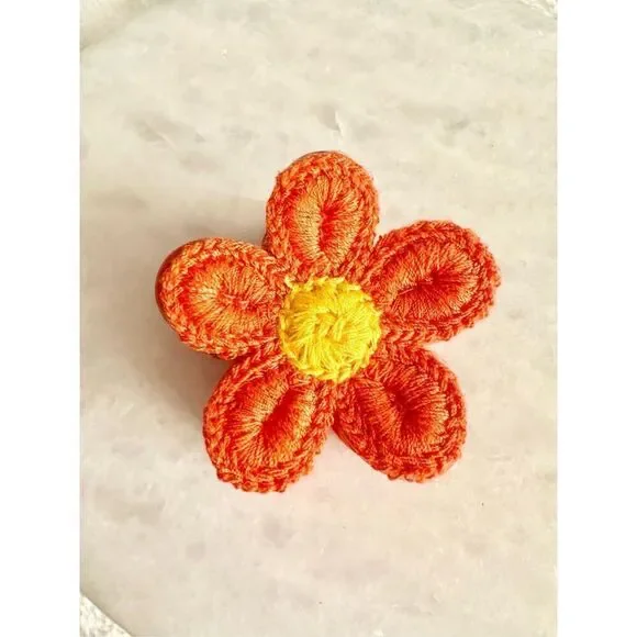 Orange and yellow crochet flower hair claw ￼