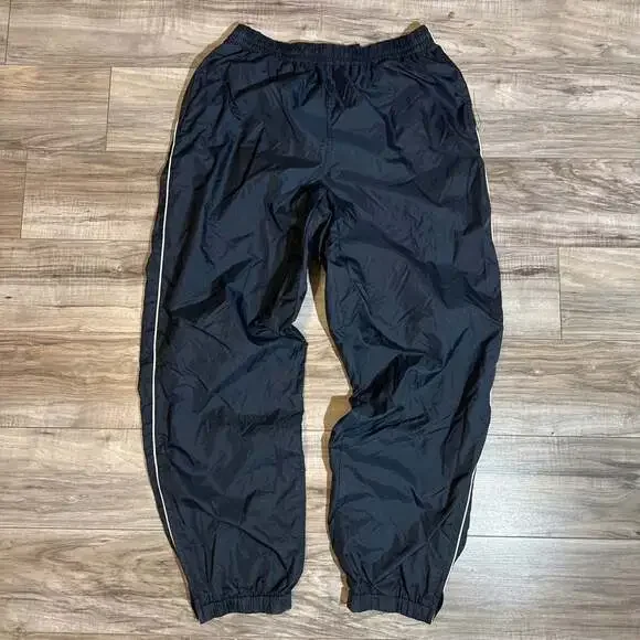Vintage Men's Navy Blue Nylon Track Pants with White Side Piping and Zip Cuffs