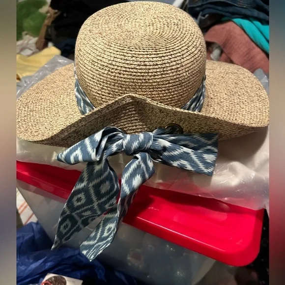 Brand: Sun n’ Sand Size: One size Color: Brown with blue and white bow