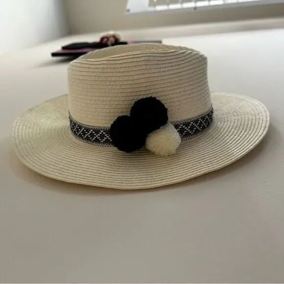 Saks Fifth Avenue Straw Hat with black and white pompoms and embroidered design