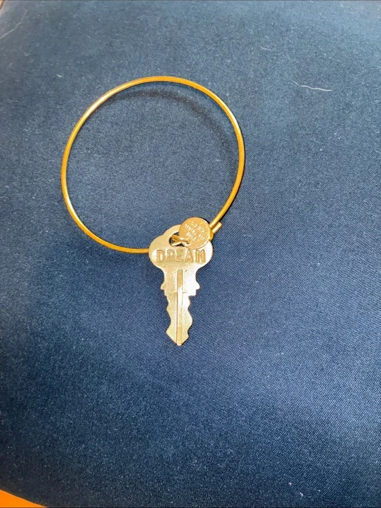 Gold Tone Bangle Bracelet by the “Giving Keys”