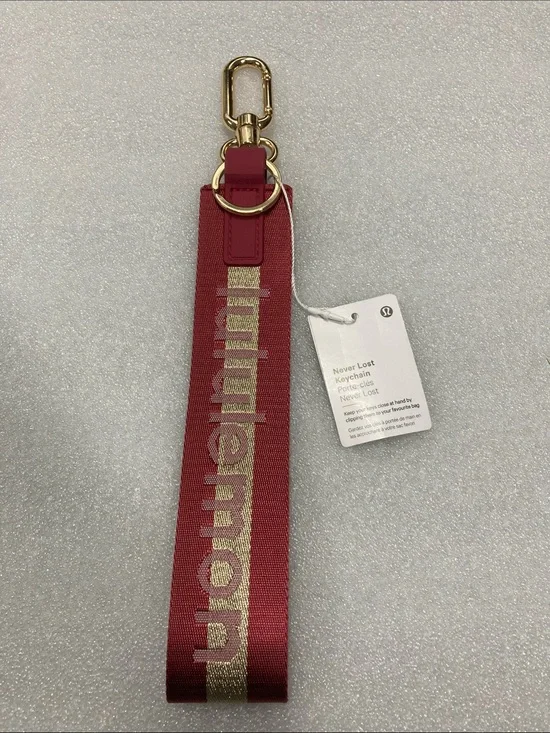 lululemon athletica Never Lost Keychain Wristlet - Maroon with Gold
