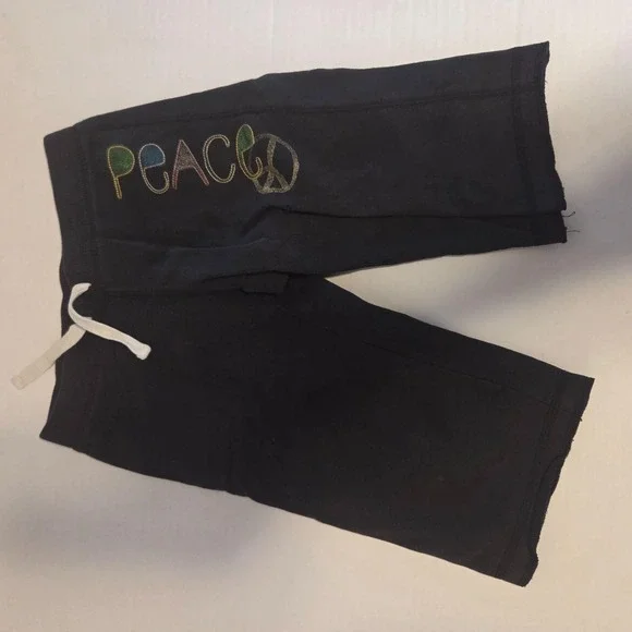 Super cozy black Hanes sweat shorts featuring a vibran