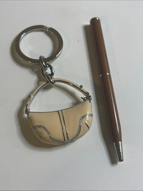 Coach Beige Enamel Handbag Keychain and Coach Pen