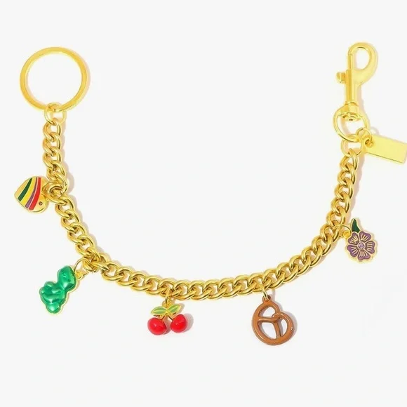 Purse bag charm in gold links with cherry pretzel flower Dino clips on bag