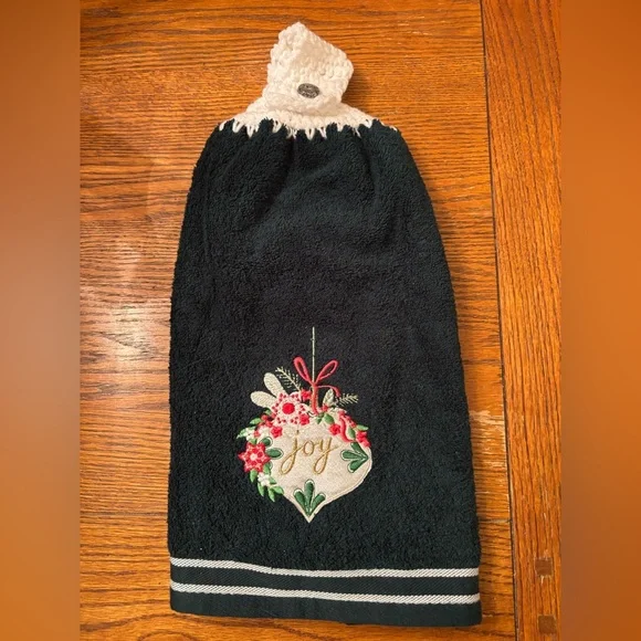 Hand crocheted “joy” ornament green/white towel
