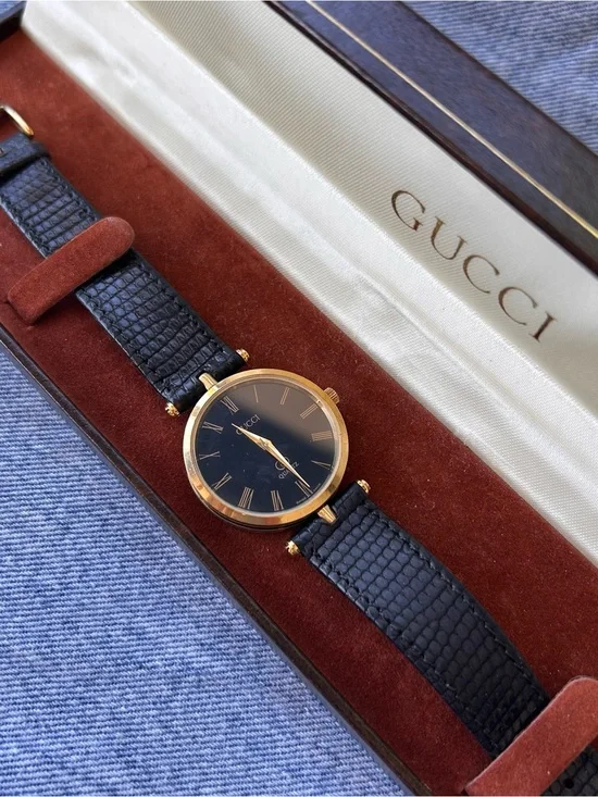 Gucci Black and Gold Round Watch