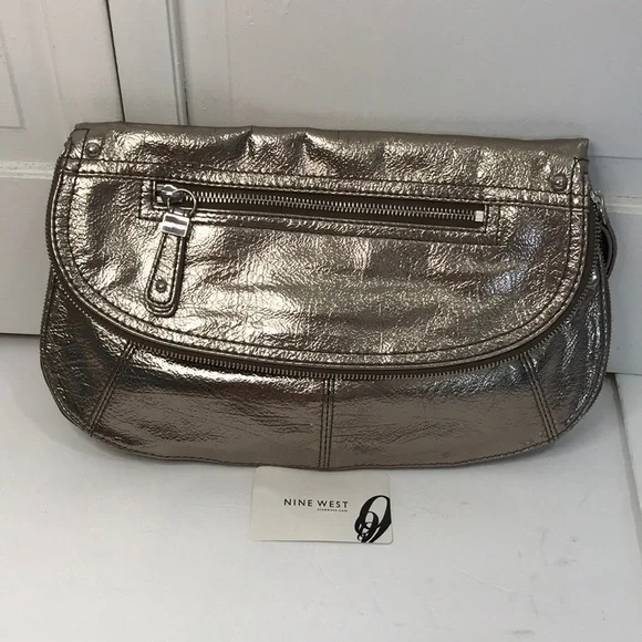 Price is firm NINE WEST Metallic Silver Zip Magnet Fold Clutch