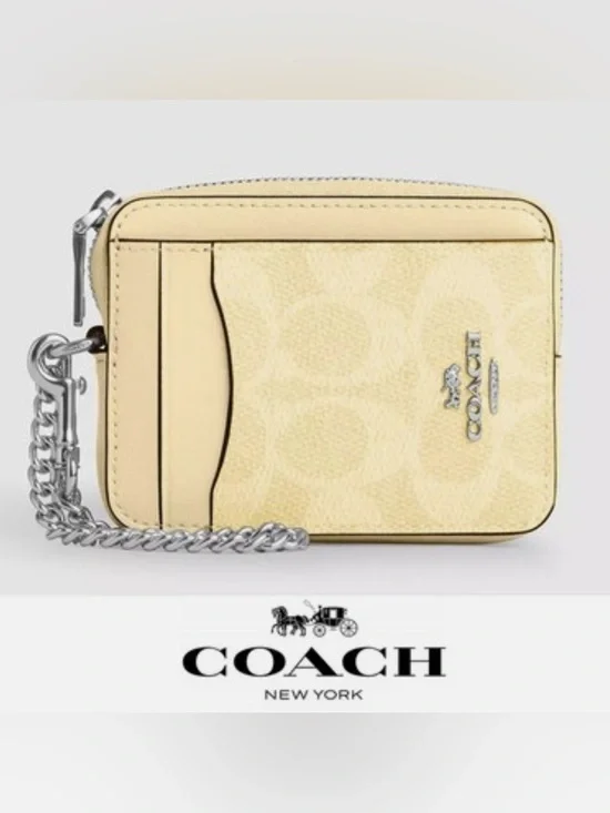 Coach Zip Card Case In Signature Canvas in the color Hay