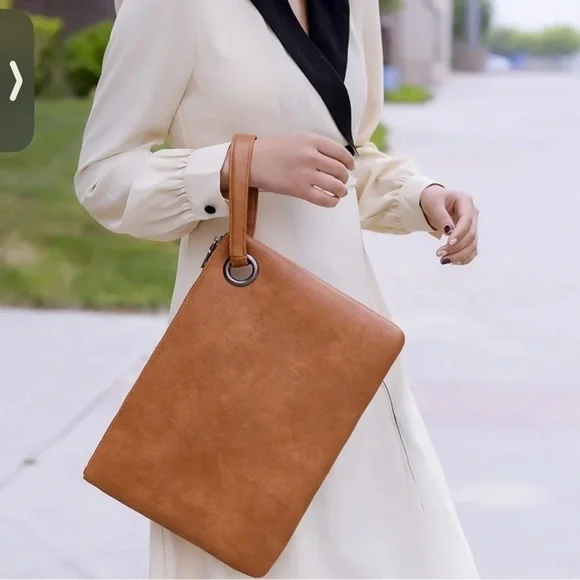 Large brown faux leather clutch wristlet with strap