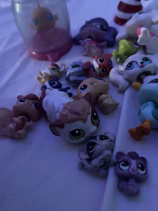 Littlest Pet Shop assorted animal figures in purple, white, brown, green, orange
