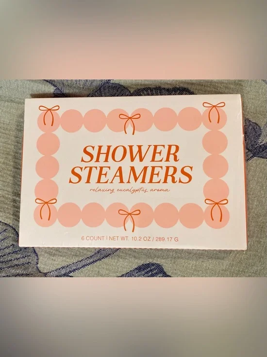 Spritz Shower Steamers in Pink and Orange Packaging