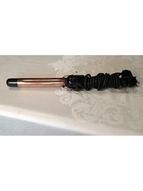 Hot Tools Pro Artist Curling Iron features a rose gold styling surface designed